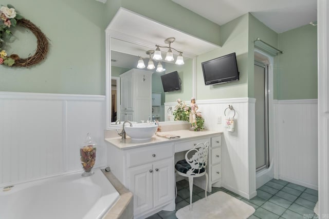 111 Country Oaks Dr, Malvern, AR 72104 - bathroom with wainscoting, vanity, a shower stall, a bath, and tile patterned flooring