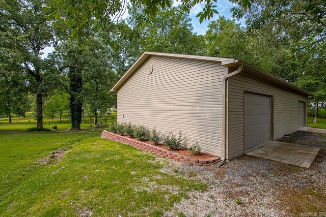 111 Country Oaks Dr, Malvern, AR 72104 - view of home's exterior with a detached garage, a yard, and view of wooded area