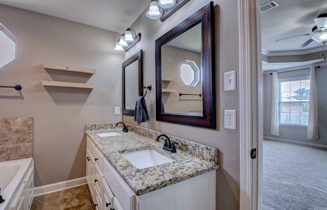 68 Smarty Jones Cir, Austin, AR 72007 - full bath featuring double vanity, a tub to relax in, a ceiling fan, and baseboards