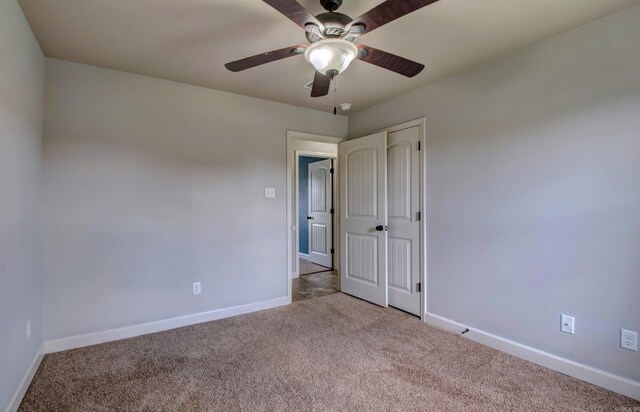 68 Smarty Jones Cir, Austin, AR 72007 - carpeted spare room featuring baseboards and ceiling fan
