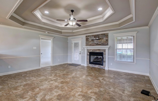 68 Smarty Jones Cir, Austin, AR 72007 - unfurnished living room with a raised ceiling, ceiling fan, a stone fireplace, and ornamental molding