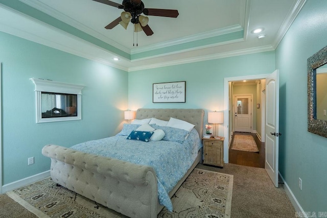 402 Nicholson Rd, Searcy, AR 72143 - bedroom with crown molding, baseboards, a tray ceiling, recessed lighting, and carpet flooring