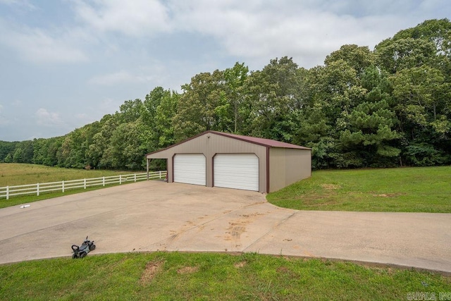 402 Nicholson Rd, Searcy, AR 72143 - garage with a detached garage and a forest view