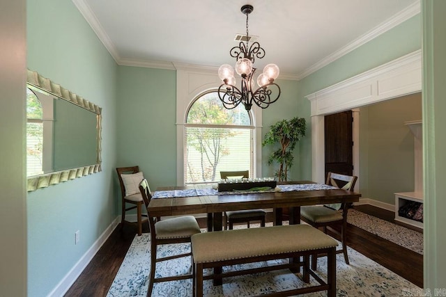 402 Nicholson Rd, Searcy, AR 72143 - dining space featuring dark wood-type flooring, crown molding, a chandelier, and baseboards
