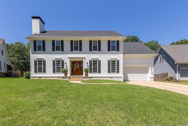 40 Tennyson Ct, North Little Rock, AR 72116 - colonial home with a chimney, driveway, and a garage