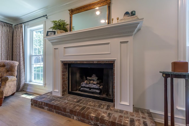 40 Tennyson Ct, North Little Rock, AR 72116 - detailed view of a fireplace, crown molding, wood finished floors, and baseboards