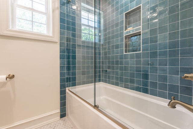 40 Tennyson Ct, North Little Rock, AR 72116 - full bathroom featuring bath / shower combo with glass door, baseboards, and tile patterned flooring