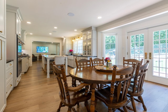 40 Tennyson Ct, North Little Rock, AR 72116 - dining room featuring healthy amount of natural light, crown molding, light wood-style flooring, and recessed lighting