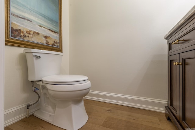 40 Tennyson Ct, North Little Rock, AR 72116 - bathroom featuring toilet, wood finished floors, and baseboards