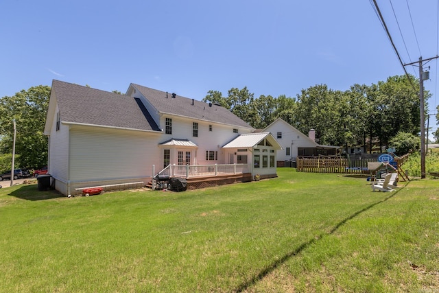 40 Tennyson Ct, North Little Rock, AR 72116 - rear view of house featuring a deck, a yard, and a shingled roof