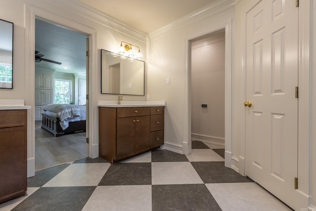 40 Tennyson Ct, North Little Rock, AR 72116 - full bath featuring vanity, ensuite bathroom, crown molding, ceiling fan, and baseboards