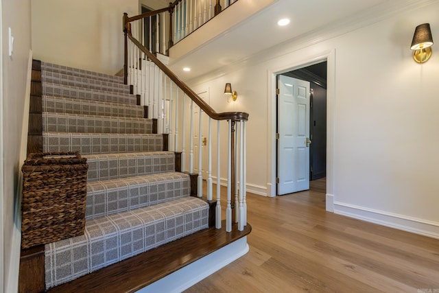 40 Tennyson Ct, North Little Rock, AR 72116 - stairway featuring baseboards, wood finished floors, crown molding, and recessed lighting