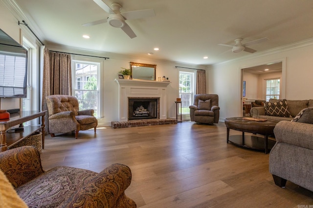 40 Tennyson Ct, North Little Rock, AR 72116 - living room featuring a ceiling fan, crown molding, wood finished floors, recessed lighting, and a fireplace