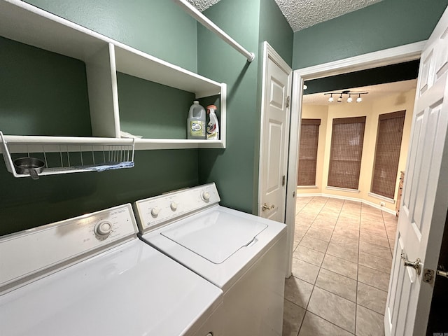1828 Dove Dr, Benton, AR 72015 - washroom featuring independent washer and dryer, a textured ceiling, track lighting, and tile patterned flooring