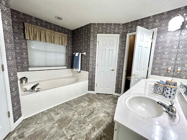 1828 Dove Dr, Benton, AR 72015 - full bath with a textured ceiling, a garden tub, wallpapered walls, and double vanity