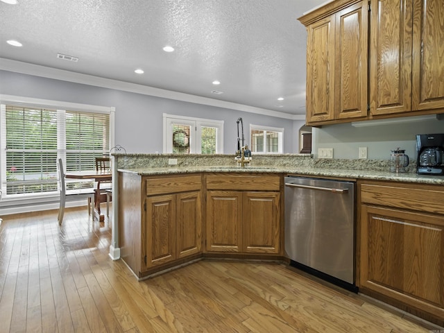 57 Excelso Way, Hot Springs Village, AR 71909 - kitchen with stainless steel dishwasher, a sink, ornamental molding, brown cabinets, and a textured ceiling