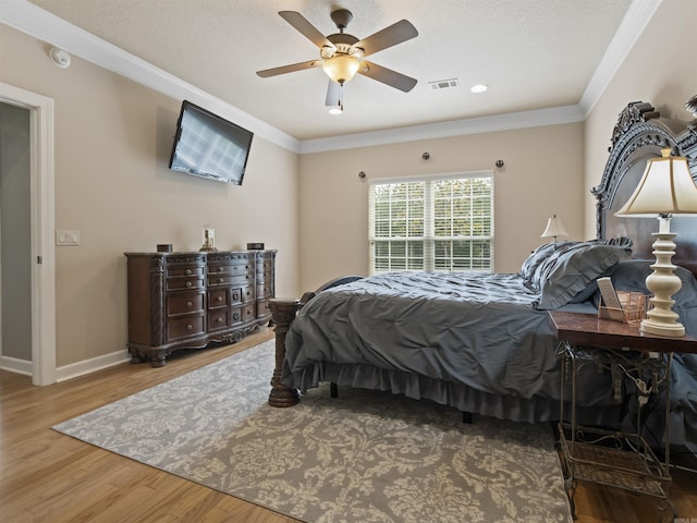 57 Excelso Way, Hot Springs Village, AR 71909 - bedroom featuring crown molding, wood finished floors, baseboards, a ceiling fan, and recessed lighting