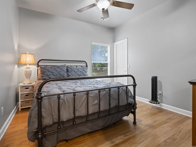 57 Excelso Way, Hot Springs Village, AR 71909 - bedroom featuring baseboards, light wood finished floors, and a ceiling fan
