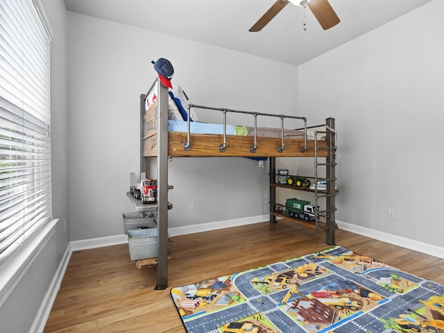 57 Excelso Way, Hot Springs Village, AR 71909 - bedroom featuring wood finished floors, baseboards, and ceiling fan
