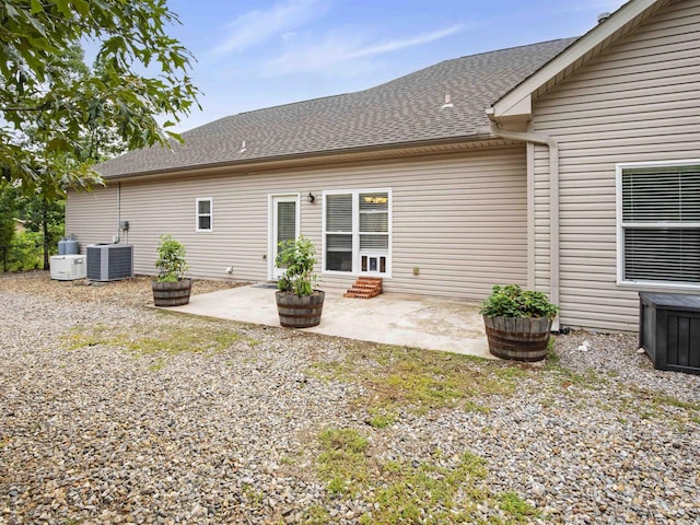 57 Excelso Way, Hot Springs Village, AR 71909 - back of house featuring a patio, roof with shingles, central AC unit, and entry steps