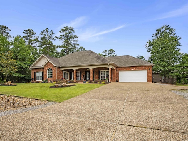 57 Excelso Way, Hot Springs Village, AR 71909 - view of front of house featuring concrete driveway, an attached garage, a front yard, and brick siding