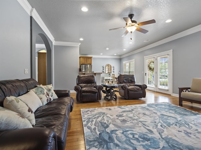 57 Excelso Way, Hot Springs Village, AR 71909 - living area with arched walkways, ornamental molding, ceiling fan, light wood finished floors, and recessed lighting