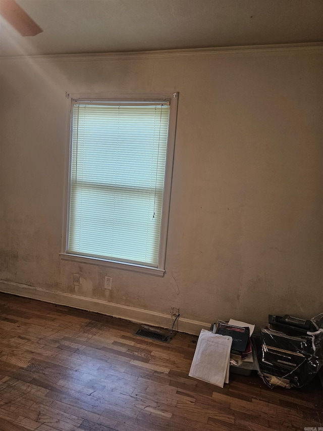 1710 N Magnolia, North Little Rock, AR 72114 - empty room featuring ornamental molding, dark wood-type flooring, and baseboards