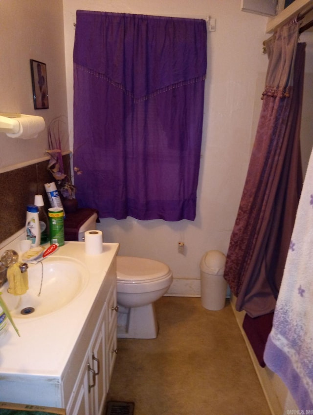 1710 N Magnolia, North Little Rock, AR 72114 - bathroom featuring vanity, toilet, and a shower with shower curtain