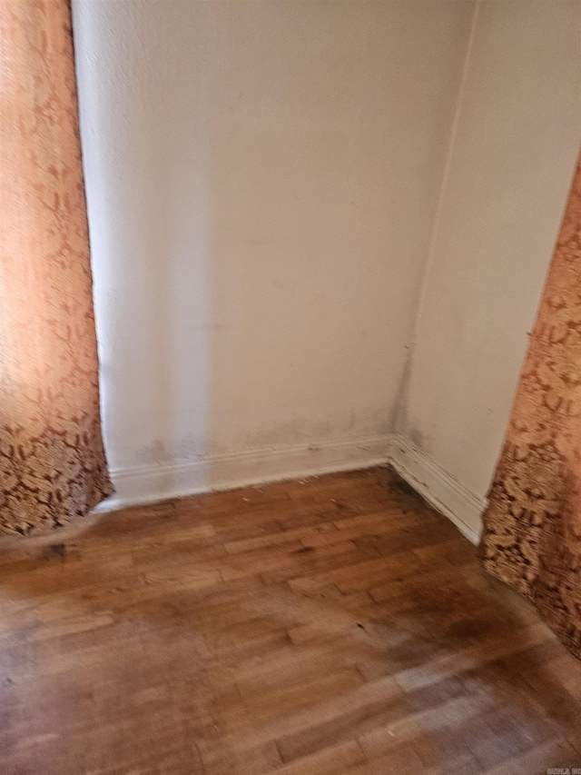 1710 N Magnolia, North Little Rock, AR 72114 - empty room featuring wood finished floors and baseboards