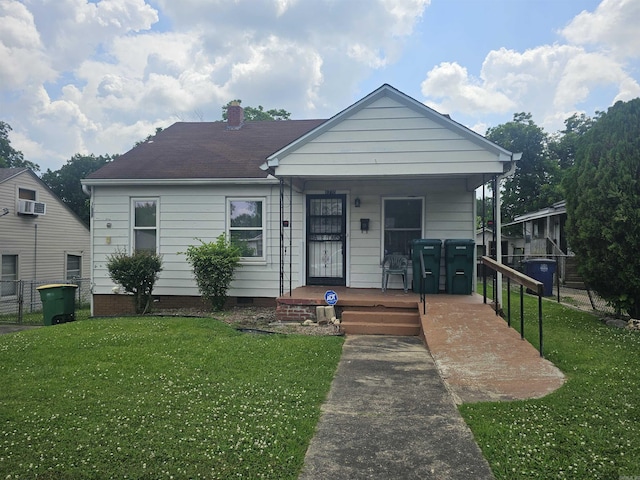 1710 N Magnolia, North Little Rock, AR 72114 - view of front of property with a porch, a front lawn, a chimney, and crawl space