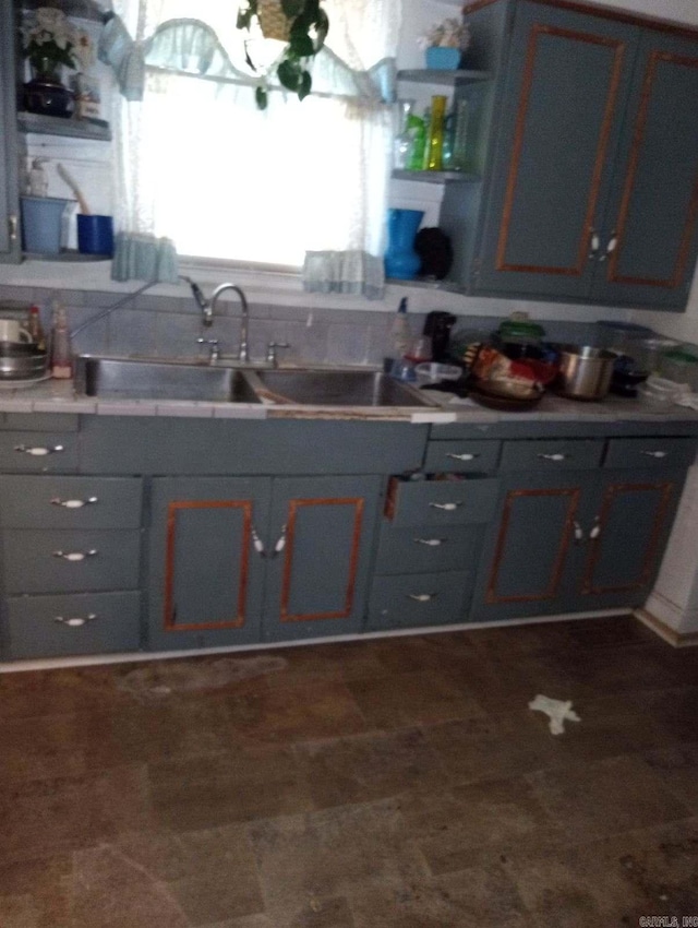 1710 N Magnolia, North Little Rock, AR 72114 - kitchen with gray cabinetry, a sink, and open shelves