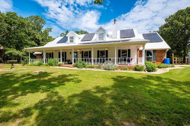 69 Quail Valley Rd, Sherwood, AR 72120 - view of front of home featuring covered porch, a chimney, a front yard, and a standing seam roof