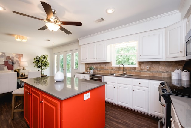 69 Quail Valley Rd, Sherwood, AR 72120 - kitchen featuring a sink, ornamental molding, stainless steel appliances, dark wood-style flooring, and ceiling fan