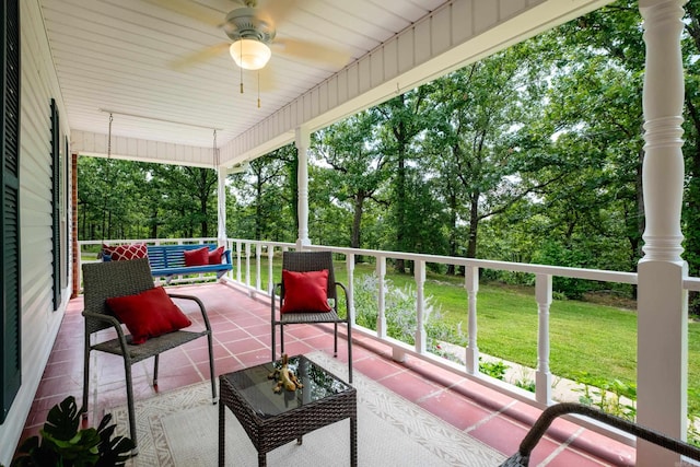 69 Quail Valley Rd, Sherwood, AR 72120 - porch with a ceiling fan, a lawn, and view of scattered trees
