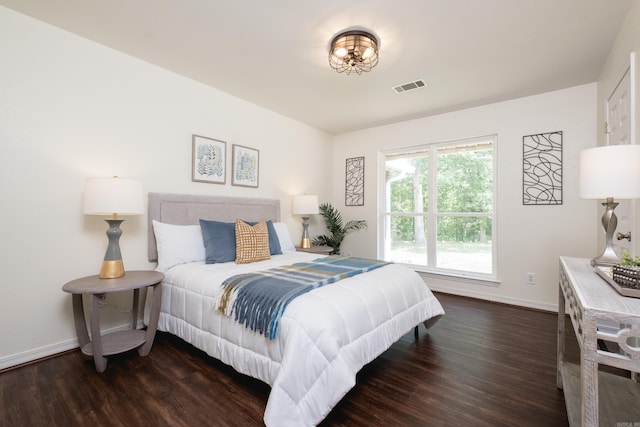 69 Quail Valley Rd, Sherwood, AR 72120 - bedroom with baseboards and wood finished floors