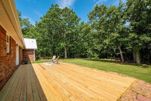 69 Quail Valley Rd, Sherwood, AR 72120 - wooden terrace with a lawn and view of wooded area