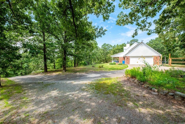 69 Quail Valley Rd, Sherwood, AR 72120 - view of yard with concrete driveway and a garage