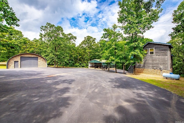 220 Brown Rd, Greers Ferry, AR 72067 - view of front facade featuring a garage and an outbuilding