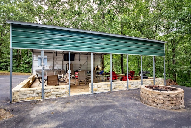 220 Brown Rd, Greers Ferry, AR 72067 - view of vehicle parking with a fire pit