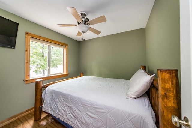 220 Brown Rd, Greers Ferry, AR 72067 - bedroom with baseboards, wood finished floors, and a ceiling fan