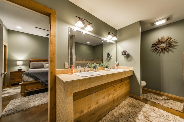 220 Brown Rd, Greers Ferry, AR 72067 - ensuite bathroom featuring double vanity and toilet