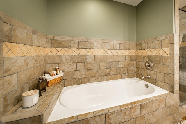 220 Brown Rd, Greers Ferry, AR 72067 - bathroom featuring tile walls and a bath