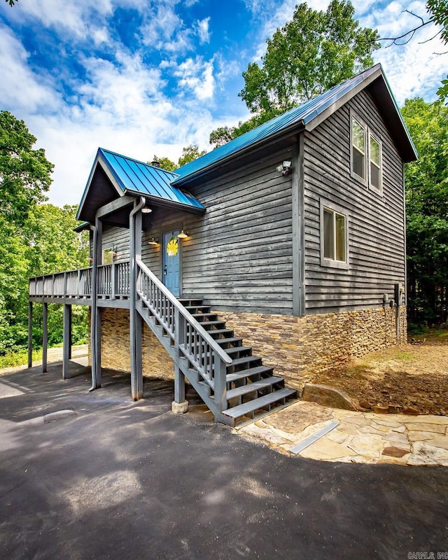 220 Brown Rd, Greers Ferry, AR 72067 - chalet / cabin with stairway, metal roof, a standing seam roof, and a wooden deck