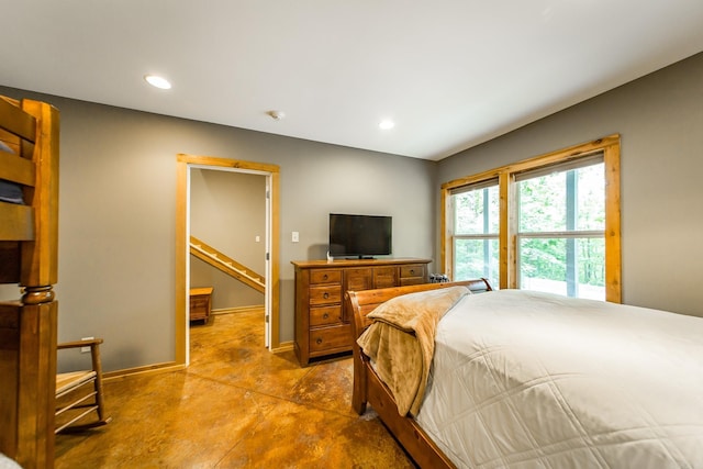 220 Brown Rd, Greers Ferry, AR 72067 - bedroom with concrete flooring, baseboards, and recessed lighting