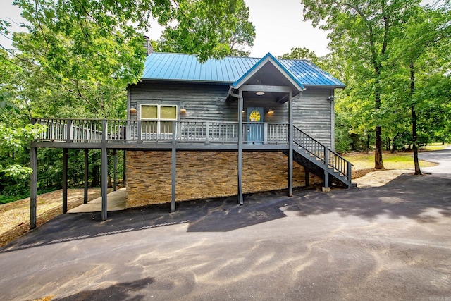 220 Brown Rd, Greers Ferry, AR 72067 - chalet / cabin featuring a chimney, metal roof, asphalt driveway, a deck, and stairway