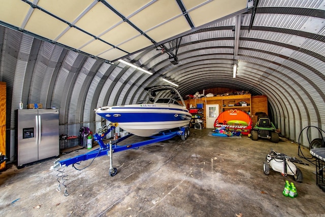220 Brown Rd, Greers Ferry, AR 72067 - garage with stainless steel fridge with ice dispenser
