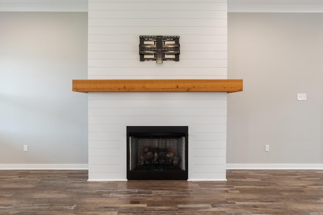 1569 Marquee Cir, Cabot, AR 72023 - detailed view of wood finished floors, baseboards, a fireplace, and ornamental molding