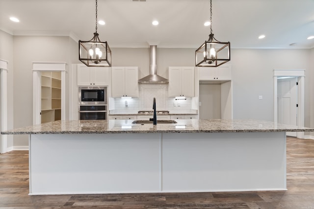 1569 Marquee Cir, Cabot, AR 72023 - kitchen with stainless steel appliances, a chandelier, wall chimney exhaust hood, crown molding, and a sink