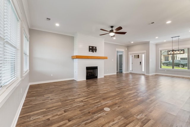 1569 Marquee Cir, Cabot, AR 72023 - unfurnished living room with a fireplace, recessed lighting, wood finished floors, baseboards, and ornamental molding
