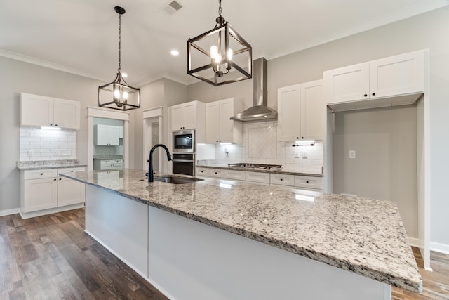 1569 Marquee Cir, Cabot, AR 72023 - kitchen with a sink, wall chimney range hood, a chandelier, appliances with stainless steel finishes, and white cabinetry